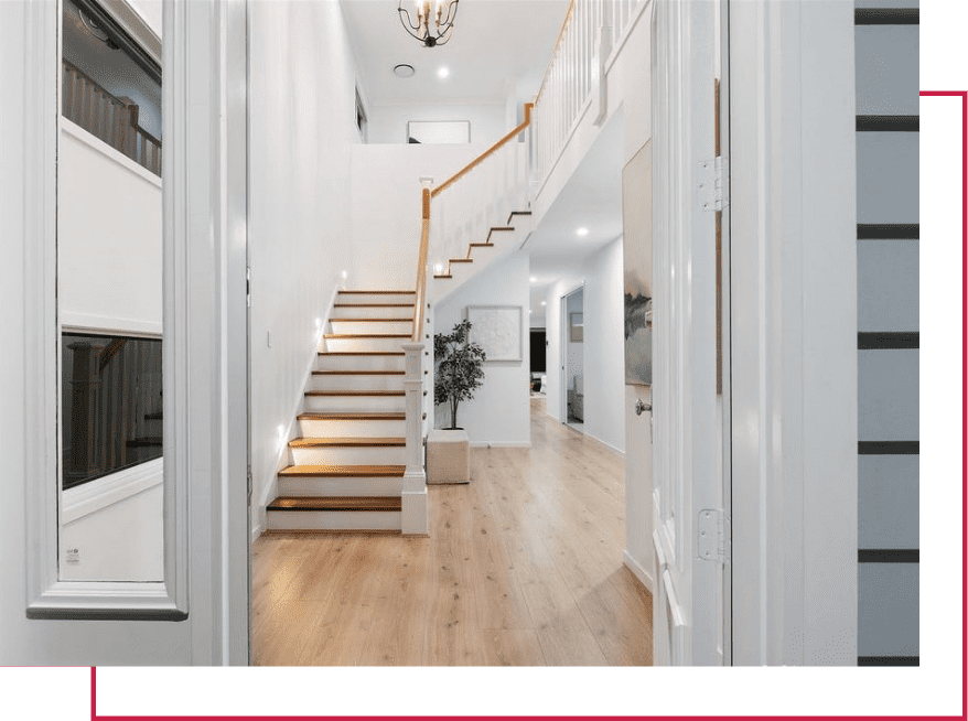 Stunning staircase in a white hallway of a modern home